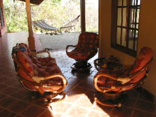 a group of chairs sitting in a room at PACIFIC VISTA, Panoramic Beach & Ocean Views in Sámara