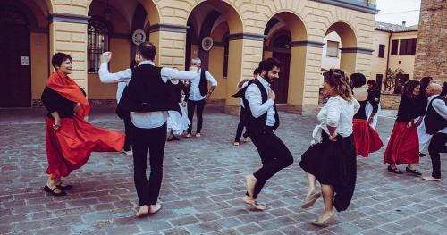 a group of people dancing in a courtyard at Casa BOUGANVILLE in Cocumola