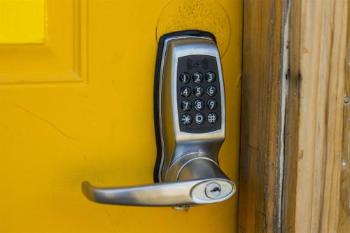 a cell phone sticking out of a door at Cape Charles Tiny Livin' in Cape Charles