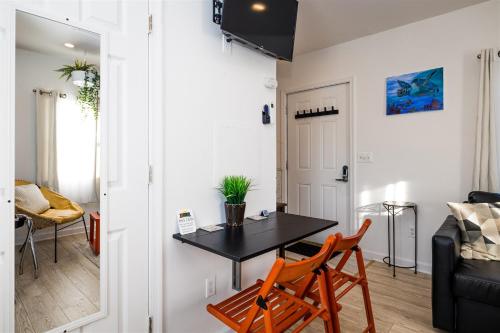 a living room with a table and two chairs at Cape Charles Tiny Livin' in Cape Charles