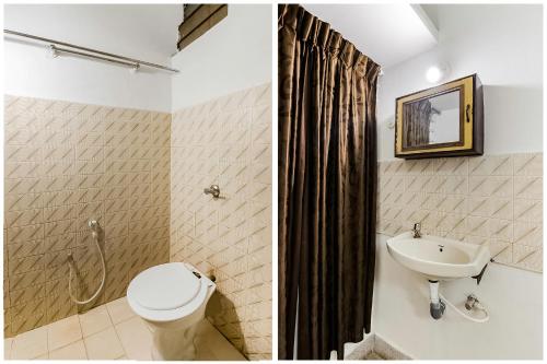 a bathroom with a toilet and a sink at Super Hotel O Sushma Lodge in Manipala