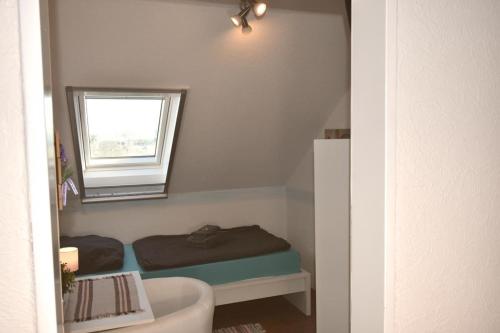 Postel nebo postele na pokoji v ubytování Ferienwohnung Zwergpinscher