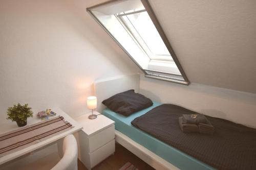 Postel nebo postele na pokoji v ubytování Ferienwohnung Zwergpinscher