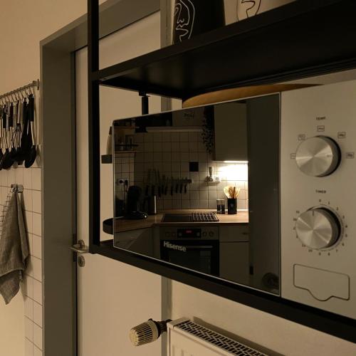 a kitchen with a sink and a stove top oven at Ferienhaus Roomina in Werlte