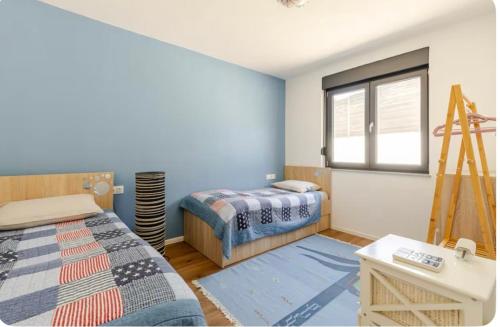 a bedroom with two beds and a window at Villa Mona with heated pool , modern comfort in Herzegovina in Mostar