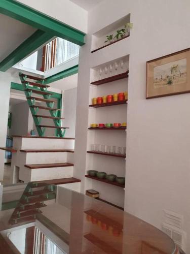 a staircase with a glass table in a room at Casa María Josefina in Rosario