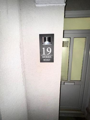 a sign on a wall next to a door at Serene Suite Rooms 1 - 5 in Southampton