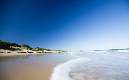 a view of the beach with a heart in the sand at Wyndham Resort Torquay in Torquay