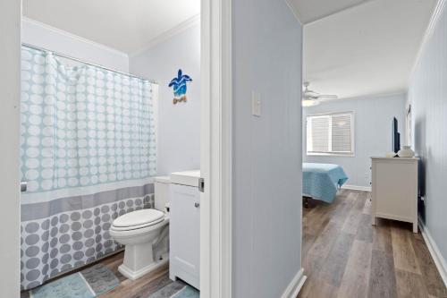 a bathroom with a toilet and a shower at I'll Be There For You in Ocean Isle Beach