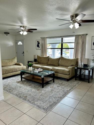 a living room with a couch and a coffee table at Peaceful Home in Central Florida Near Universal in Orlando