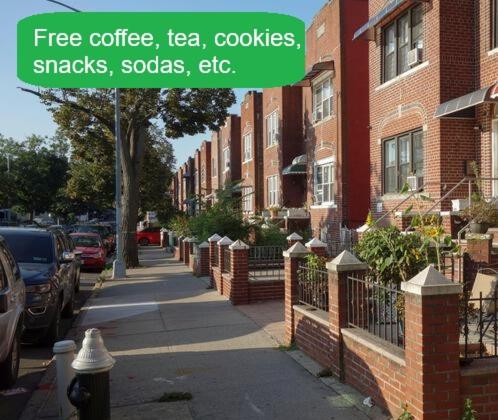 a sign that reads free coffee tea tea cookiessnackscoats at Men House JFK Airport in Brooklyn Manor