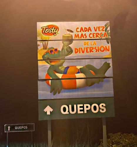 a sign for azonazona mars agency with a dinosaur on it at Casa a solo 20 minutos aproximadamente de Manuel Antonio Beach y a 10 minutos aproximadamente del centro de Quepos in Quepos