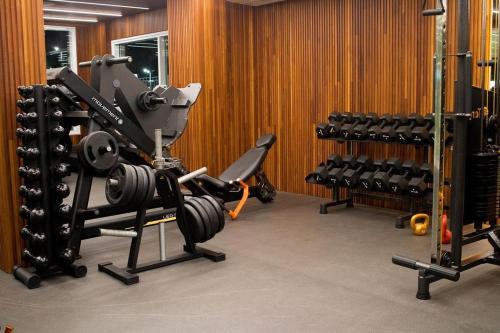 a gym with a bunch of equipment in a room at Salinas Park Resort in Salinópolis