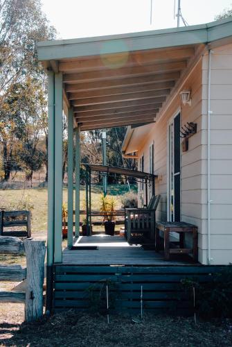 a porch with a bench on a house at Glenview Alpaca Farm in Yass