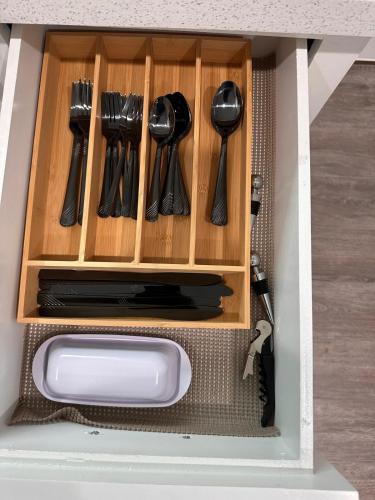a drawer in a toy kitchen with utensils at Premier Luxe Villa in Weslaco