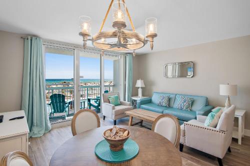 a living room with a couch and a table at Pelican Beach Resort Destin in Destin