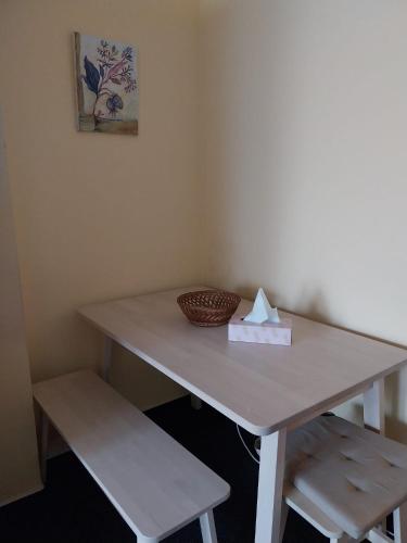 a table with a napkin and a basket on it at Wellness apartmán Frymburk D403 Čtvrté patro in Frymburk