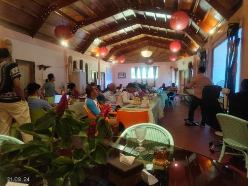 a group of people sitting at tables in a room at Carabao Island Observatory and Think Tank in San Jose