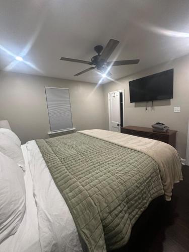 a bedroom with a bed and a ceiling fan at Home in North Wilmington in Wilmington