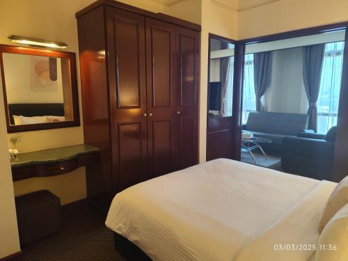 Postel nebo postele na pokoji v ubytování Citypluse Suites at Times Square Kuala Lumpur