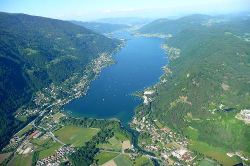 an aerial view of a lake in the mountains at Wellness Landhaus Parth in Ossiach