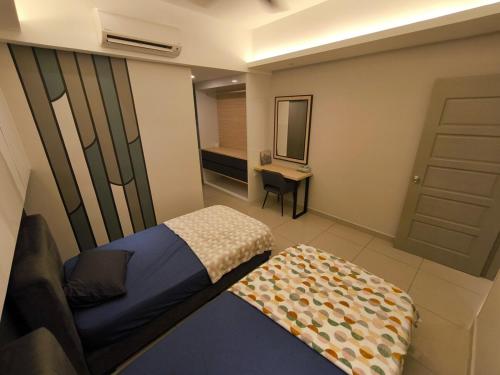 a small bedroom with a bed and a mirror at Venus Home Retreat - Pool,Gym,Playground,Rooftop Garden View in Kampong Lumut Kiri