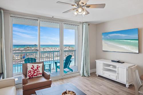 a living room with a view of the ocean at Pelican Beach Resort Destin in Destin