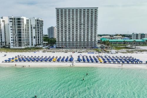 an aerial view of a beach with chairs and umbrellas at Pelican Beach Resort Destin in Destin