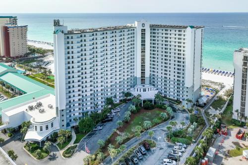 an aerial view of a large building next to the beach at Pelican Beach Resort Destin in Destin