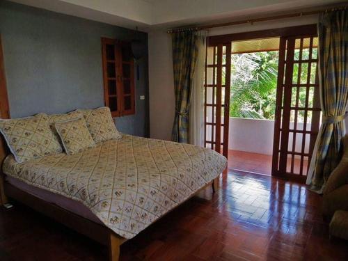 Postel nebo postele na pokoji v ubytování Bed & Breakfast Chiang Rai