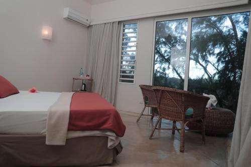 Postel nebo postele na pokoji v ubytování Andrea Lodges
