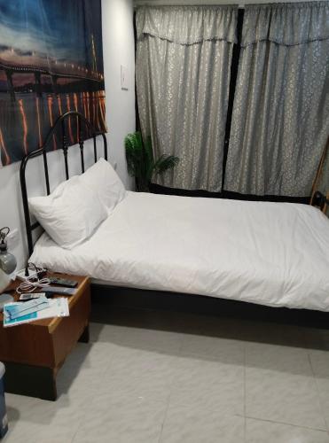 Ein Bett oder Betten in einem Zimmer der Unterkunft Long River 82 Homestay