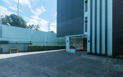 an empty parking lot in front of a building at RedDoorz at Nucell in Cebu City