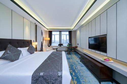 Ένα ή περισσότερα κρεβάτια σε δωμάτιο στο ME Yinhe International Hotel