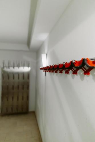 a row of red wine bottles on a wall at Charmante Ferienwohnung mit Sauna und Terrasse in Winterberg