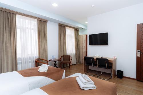 Кровать или кровати в номере Diamond Hotel Tashkent