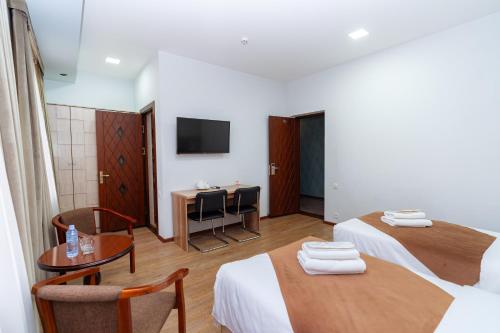 Кровать или кровати в номере Diamond Hotel Tashkent