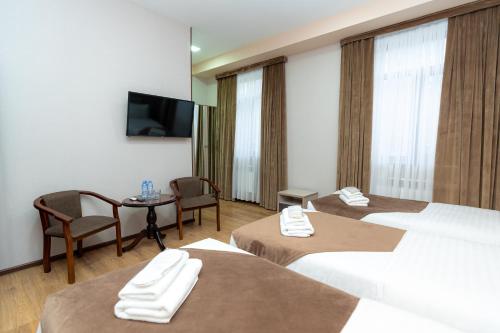 Кровать или кровати в номере Diamond Hotel Tashkent
