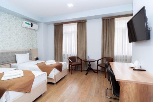 Телевизор и/или развлекательный центр в Diamond Hotel Tashkent