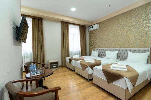 Кровать или кровати в номере Diamond Hotel Tashkent