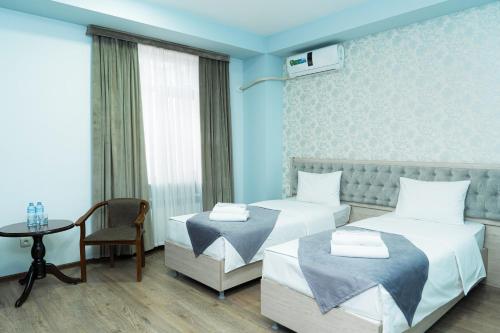 Кровать или кровати в номере Diamond Hotel Tashkent