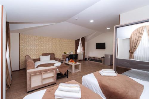 Кровать или кровати в номере Diamond Hotel Tashkent