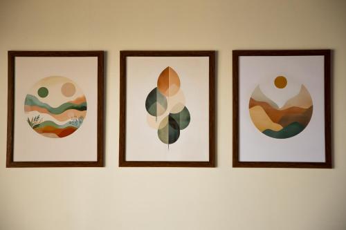 four pictures in four frames on a wall at Royal Touch Beach Huts in Palolem