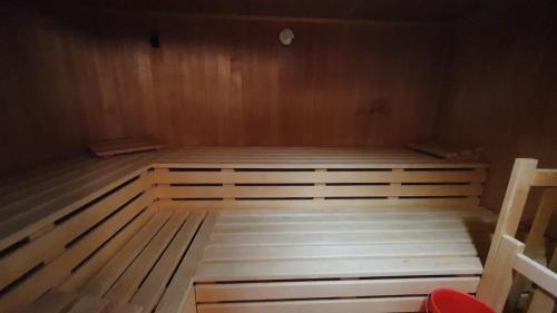 a room with two beds in a wooden room at Sofia in Balderschwang
