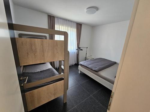 a small room with two bunk beds in it at Villa AS in Bihać