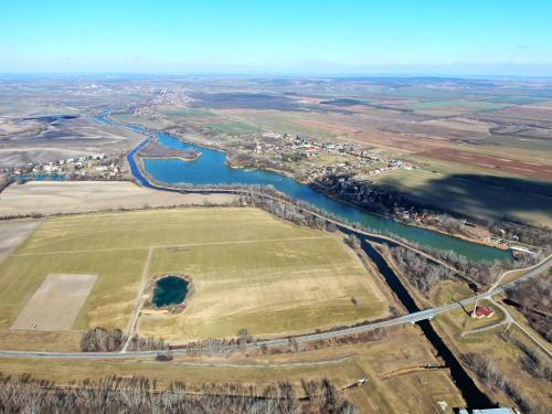 an aerial view of a field and a river at Penzión Aurora Patince in Patince
