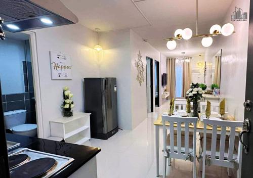 a kitchen with a sink and a counter top at Luxury Stay with Balcony, Free Gym & Pool in Bancao-Bancao - B2 6Luster in Puerto Princesa City