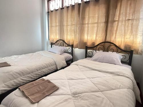 En eller flere senge i et værelse på Bestiehome Women Only