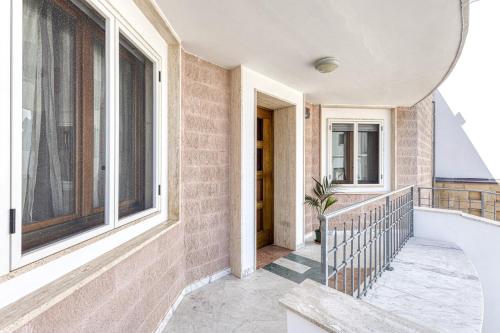 a balcony of a house with windows at Villa Urso in Ugento