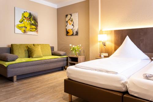 Postel nebo postele na pokoji v ubytování Hotel Aulmann